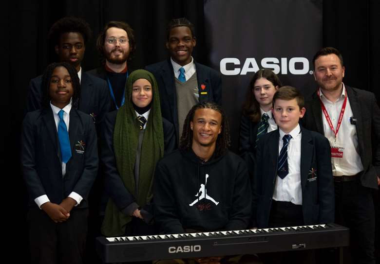From left: East Manchester Academy students with Robert Hatton, head of music, Nathan Aké, and Neil Evans, head of Casio EMI